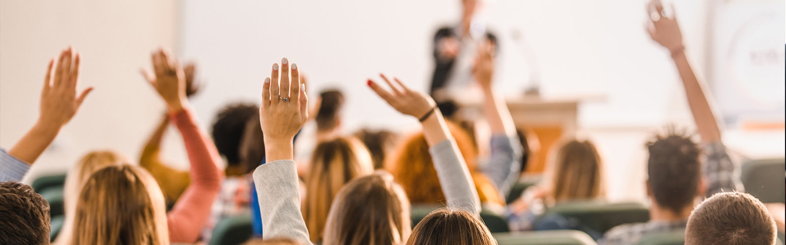 Hands raised in classroom