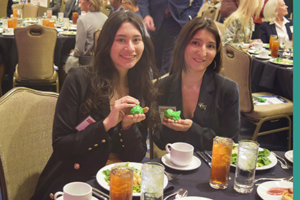 Recent graduates attending awards ceremony