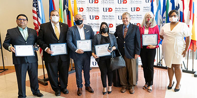 Dean Gengler photographs with guests for Hispanic Heritage Month