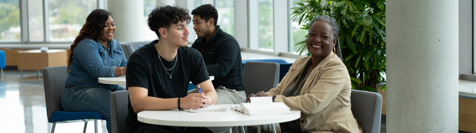 Two students at a table with books