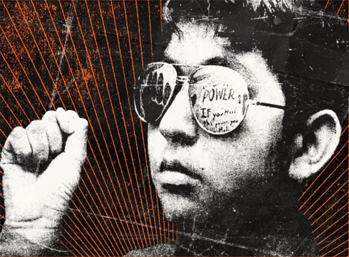 distressed image in black and white of a young boy wearing sunglasses with one fist raised