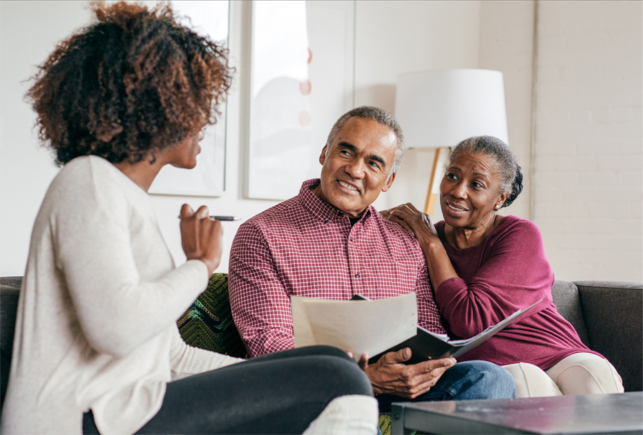 healthcare professional talking to an older couple