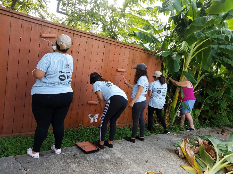 Students Painting a Fence