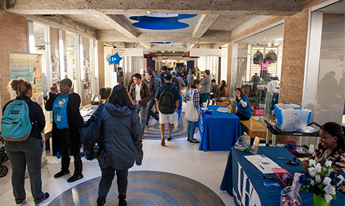 crowd of students walking in the hall