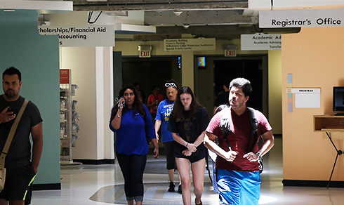 students walking past the Registrar's Office