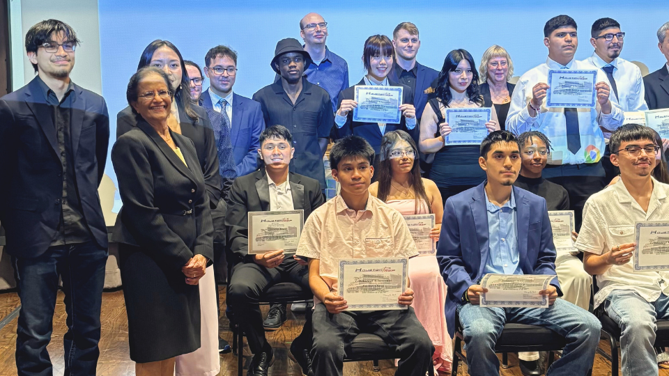 Sangeeta Gad and Houston PREP students with awards