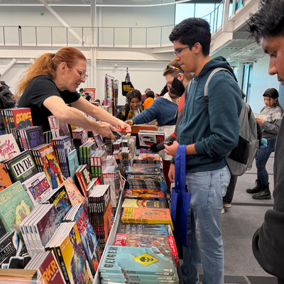 students at a comic book both at gatorcon at the wellness and success center