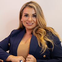 Karen De Amat, University of Houston-Downtown alumna, Finance major, and founder of founded Social Behavior, smiles