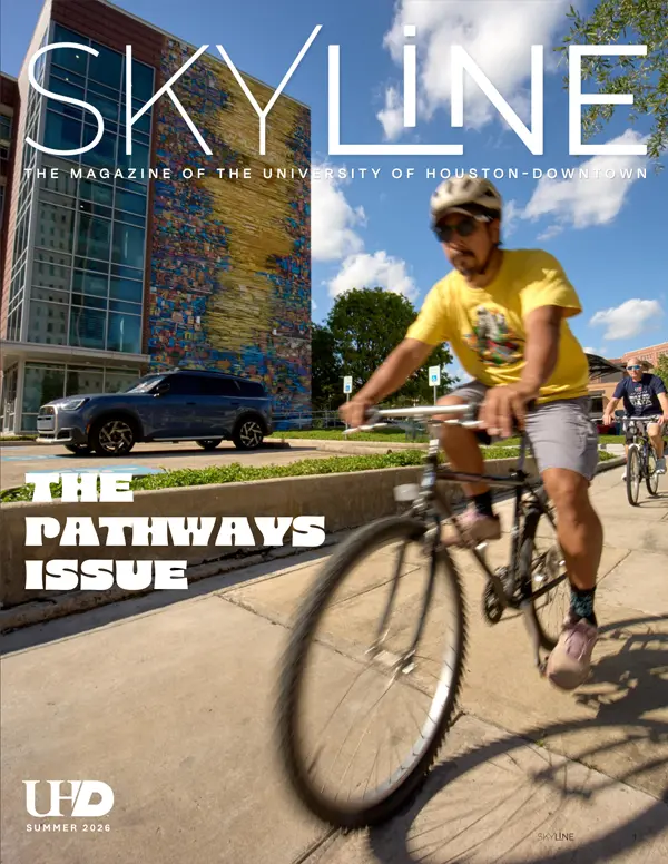 Skyline magazine cover with a man on a bike wearing a yellow shirt