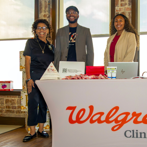 Vanessa Mattox, Student and member of university of houston downtown's black student association, smiles aside a walgreens clinical trials representatives at a community baby shower for new and expectant parents in the university community  at the university of houston downtown 