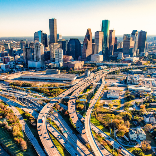 Downtown Houston and vehicles driving on the highways