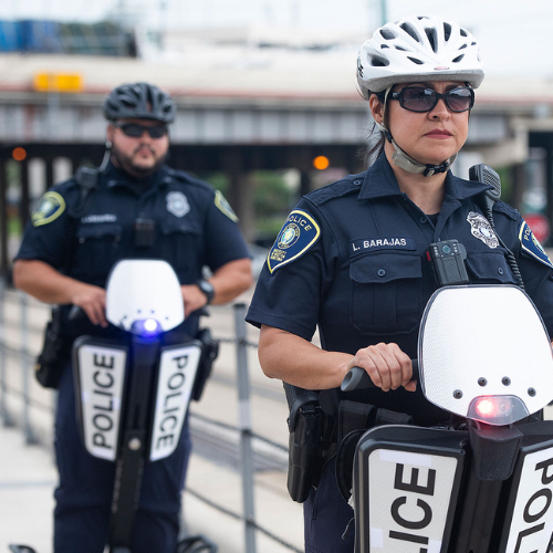 two UHDPD officers ride segways on the university of houston downtown campus