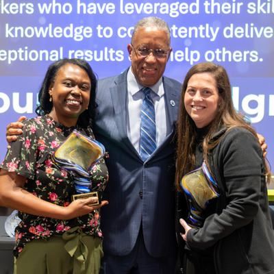 President Loren J. Blanchard stands with President Staff Excellence Award recipients Shiya Rawls and Courtney Lundgren at the 2025 Staff Awards Ceremony
