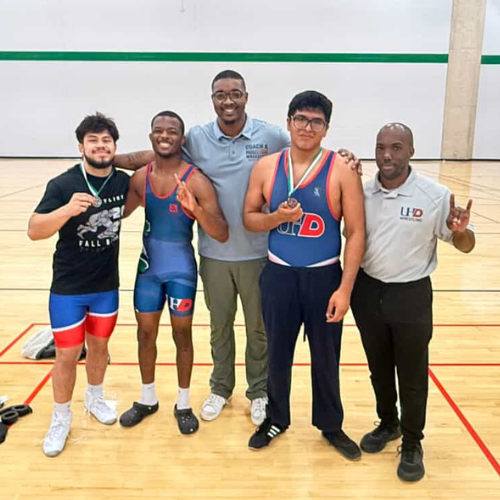 Members of the University of Houston-Downtown's Wrestling Team at a wrestling competition