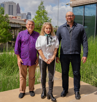 Three panelists for the university of houston-downtown's president's lecture celebrating earth day. Rice University anthropology professors Dominic Boyer and Cymene Howe, co-hosts of the podcast Cultures of Energy, and Designer, professor, and entrepreneur Nathan Shedroff smile outside the college of sciences and technology building at the university of houston-downtown